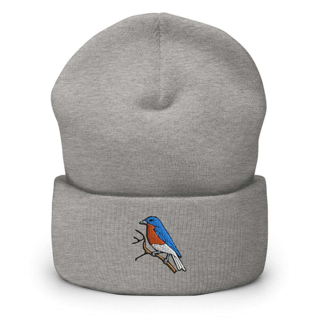 a grey beanie with a red and blue bird on it