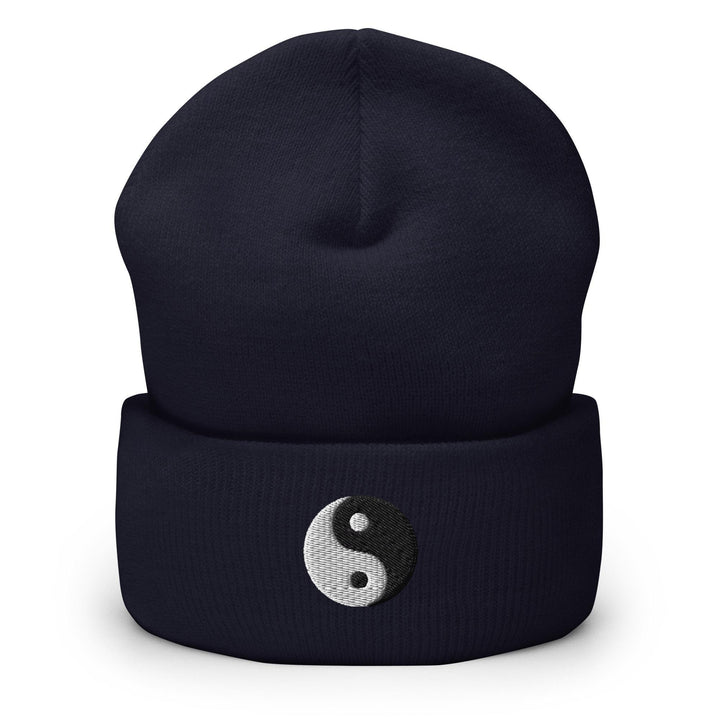 a beanie hat with a yin symbol on it