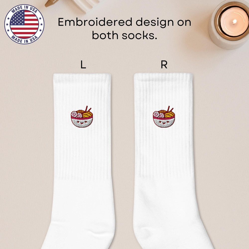 a pair of white socks with a picture of a bowl of soup on it