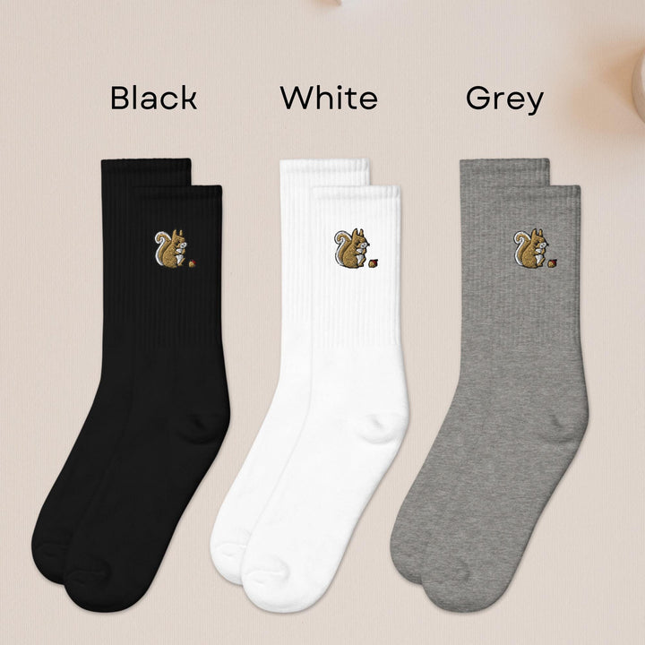 three pairs of black, white, and grey socks