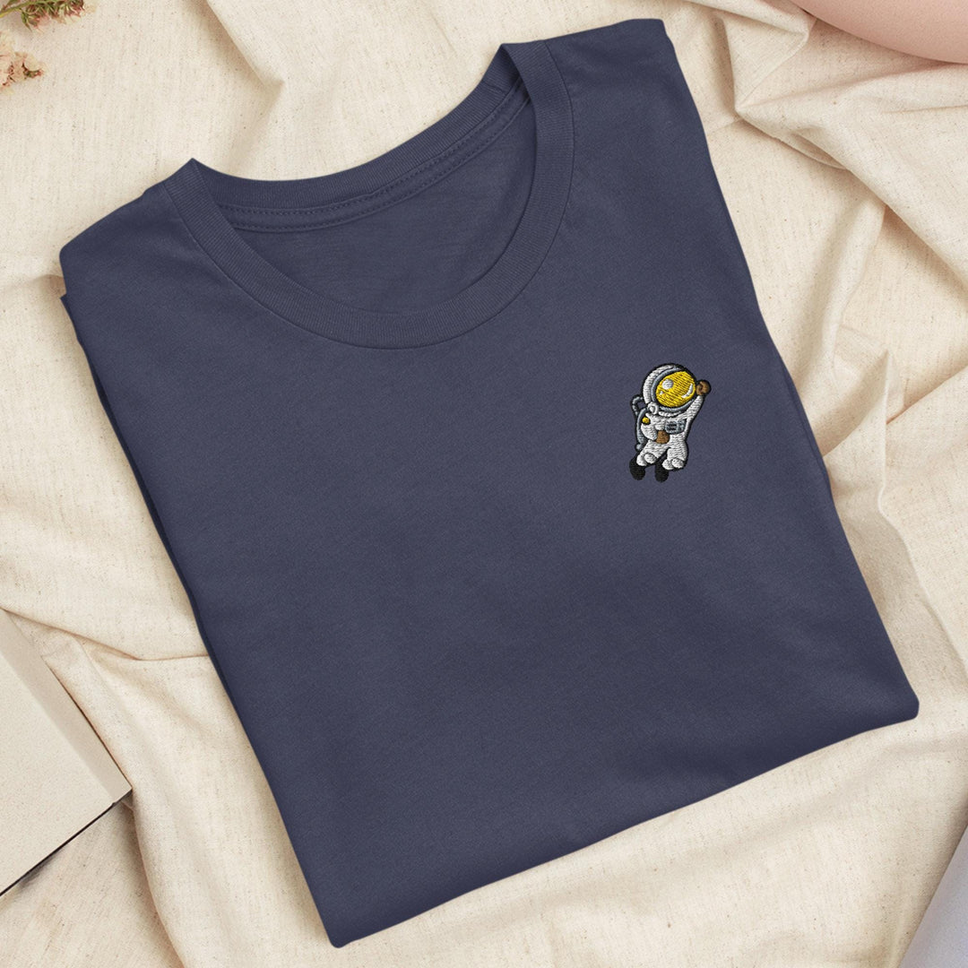 a blue t - shirt with a picture of an astronaut on it