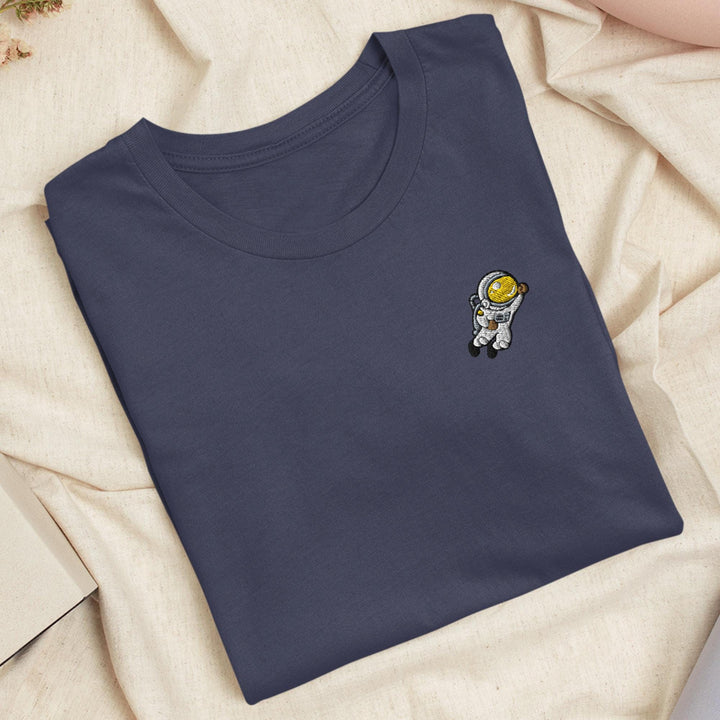 a blue t - shirt with a picture of an astronaut on it