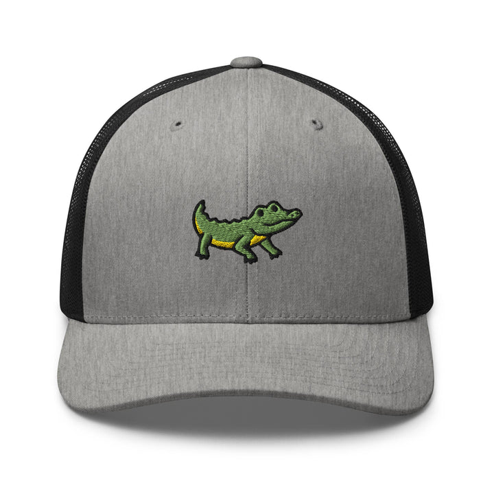 a gray and black hat with a green alligator on it