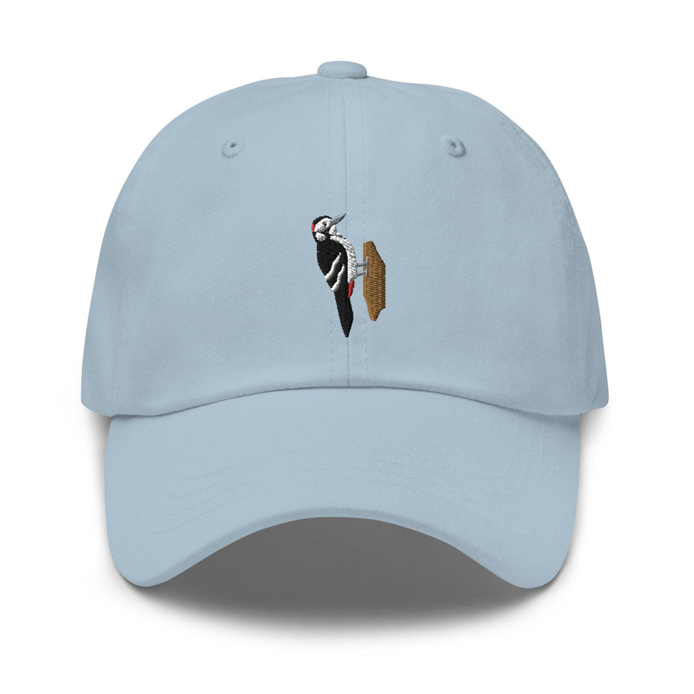 a light blue hat with a picture of a bird on it
