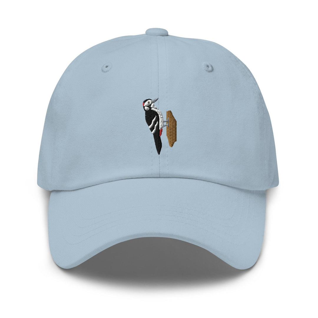 a light blue hat with a picture of a bird on it