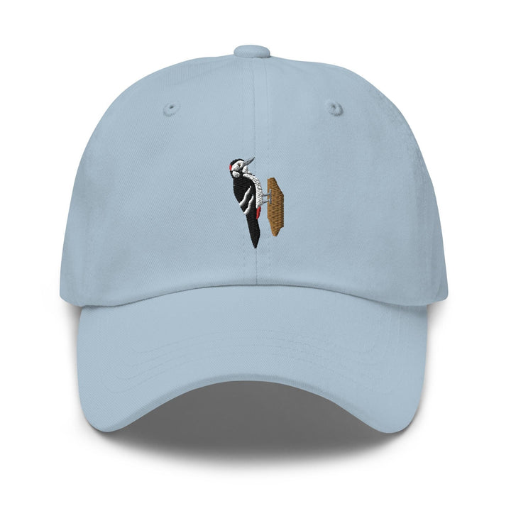 a light blue hat with a picture of a bird on it