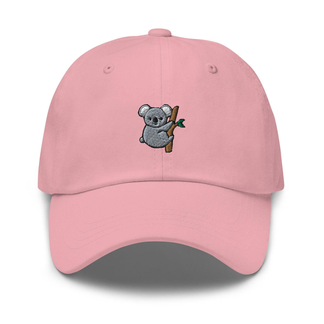 a pink hat with a koala holding a branch
