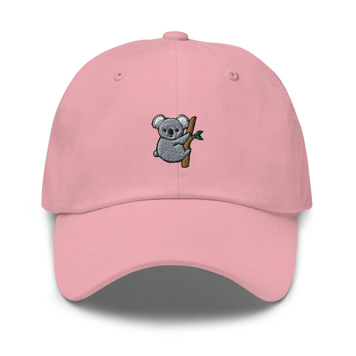 a pink hat with a koala holding a branch