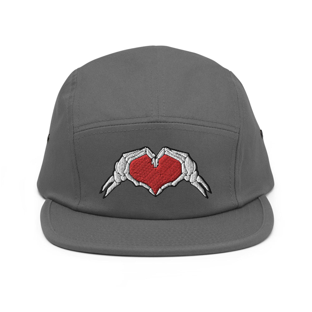 a grey hat with two hands holding a heart
