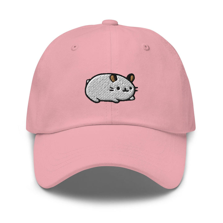 a pink hat with a cartoon pig on it