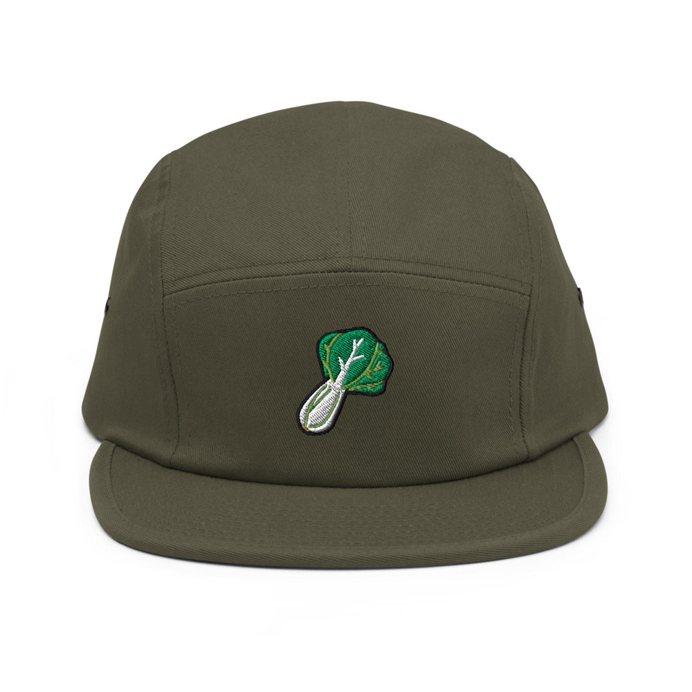a green hat with a leaf and spoon on it