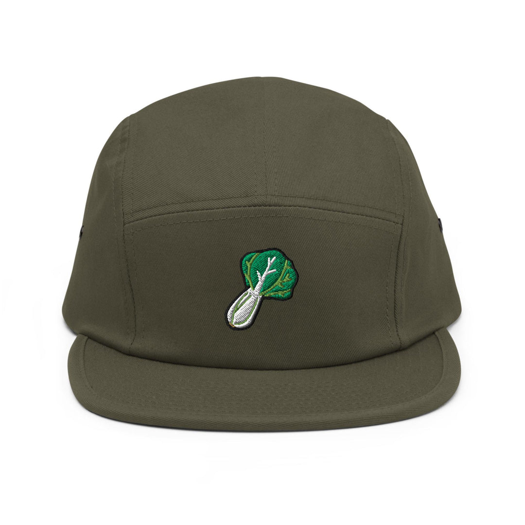 a green hat with a leaf and spoon on it