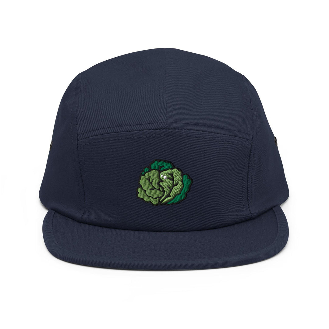 a blue hat with a green cabbage embroidered on it
