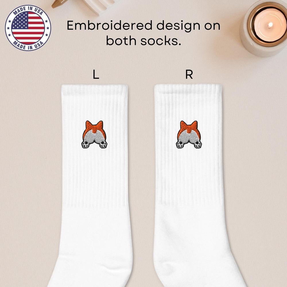 a pair of white socks with a red bow on them