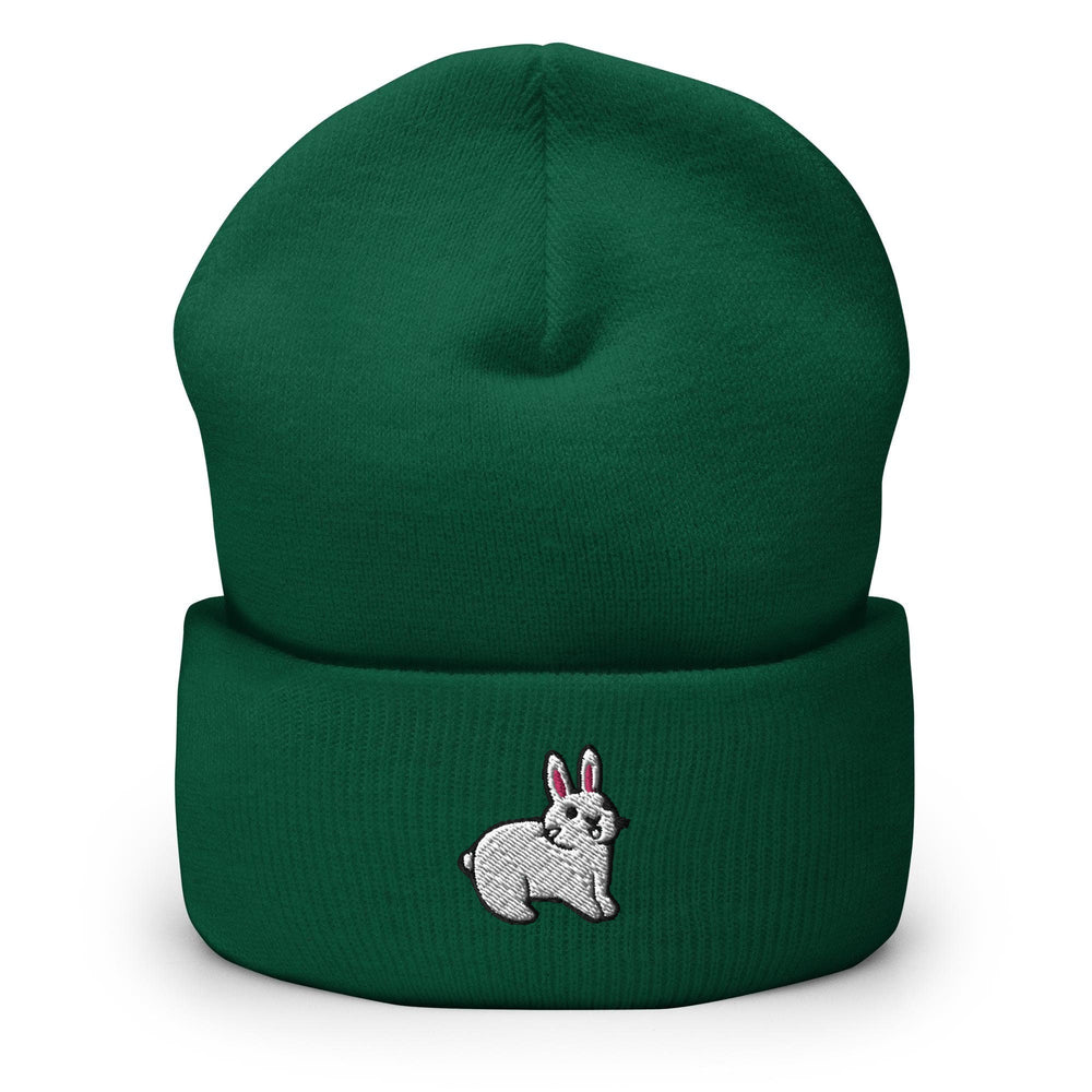 a green beanie with a white rabbit on it