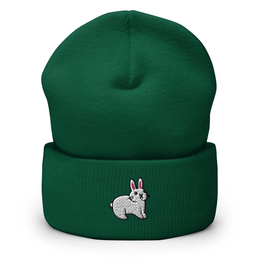 a green beanie with a white rabbit on it
