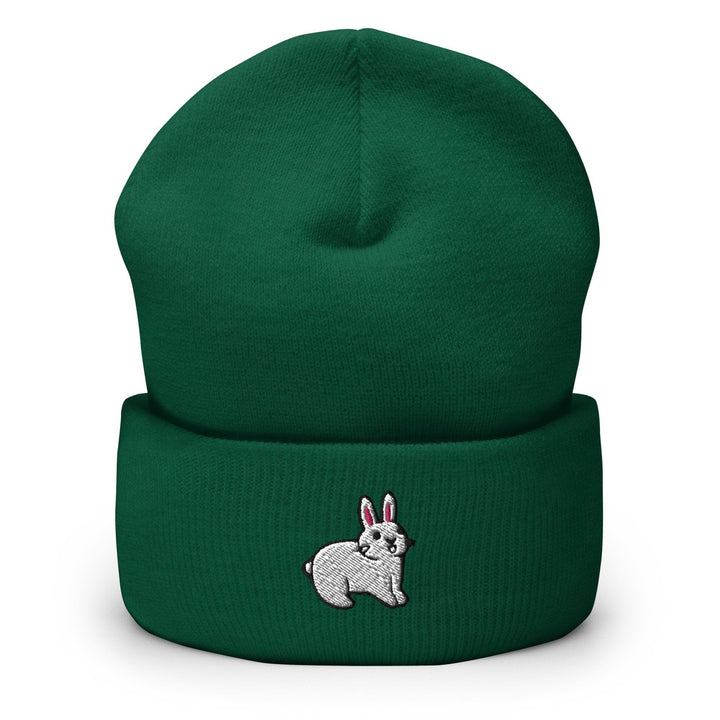 a green beanie with a white rabbit on it