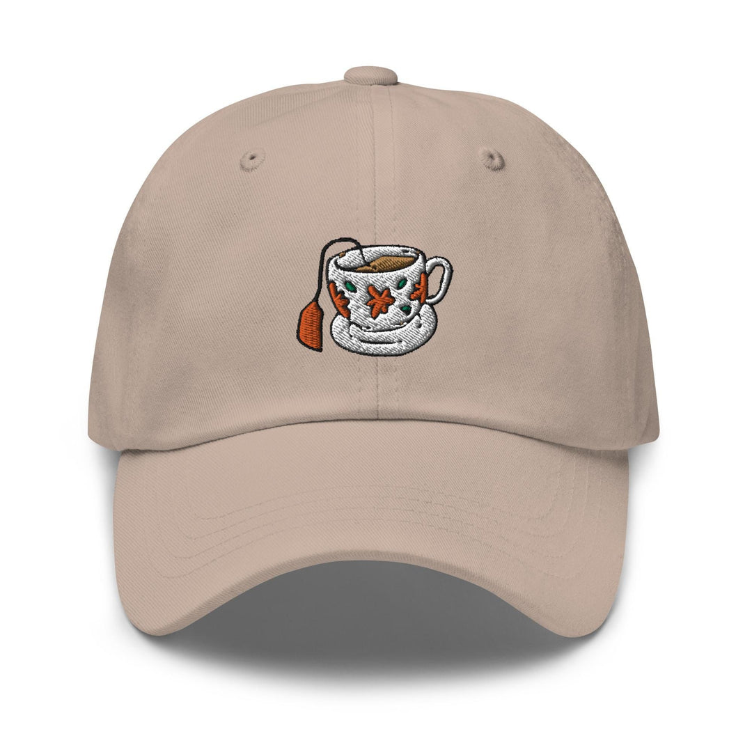 a beige hat with a coffee cup embroidered on it