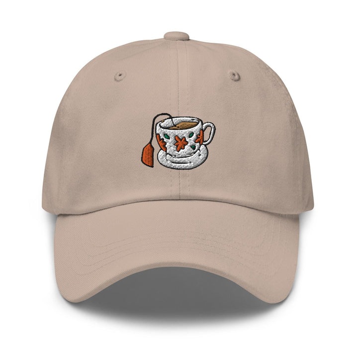 a beige hat with a coffee cup embroidered on it