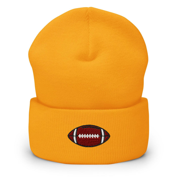 a yellow beanie with a football embroidered on it