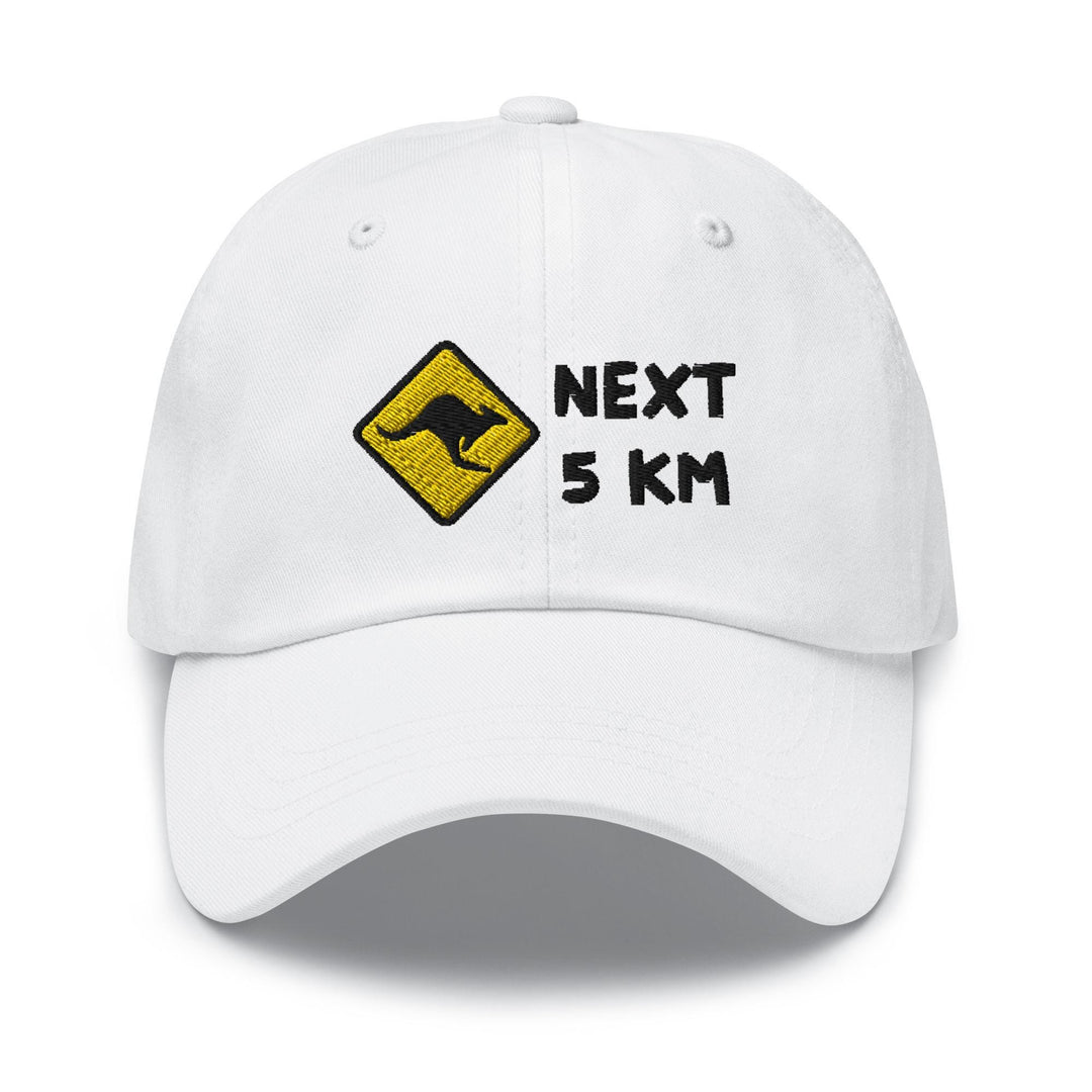 a white hat with the words next 5 km printed on it