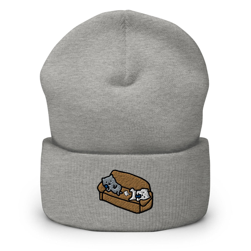 a grey beanie with two cats on it