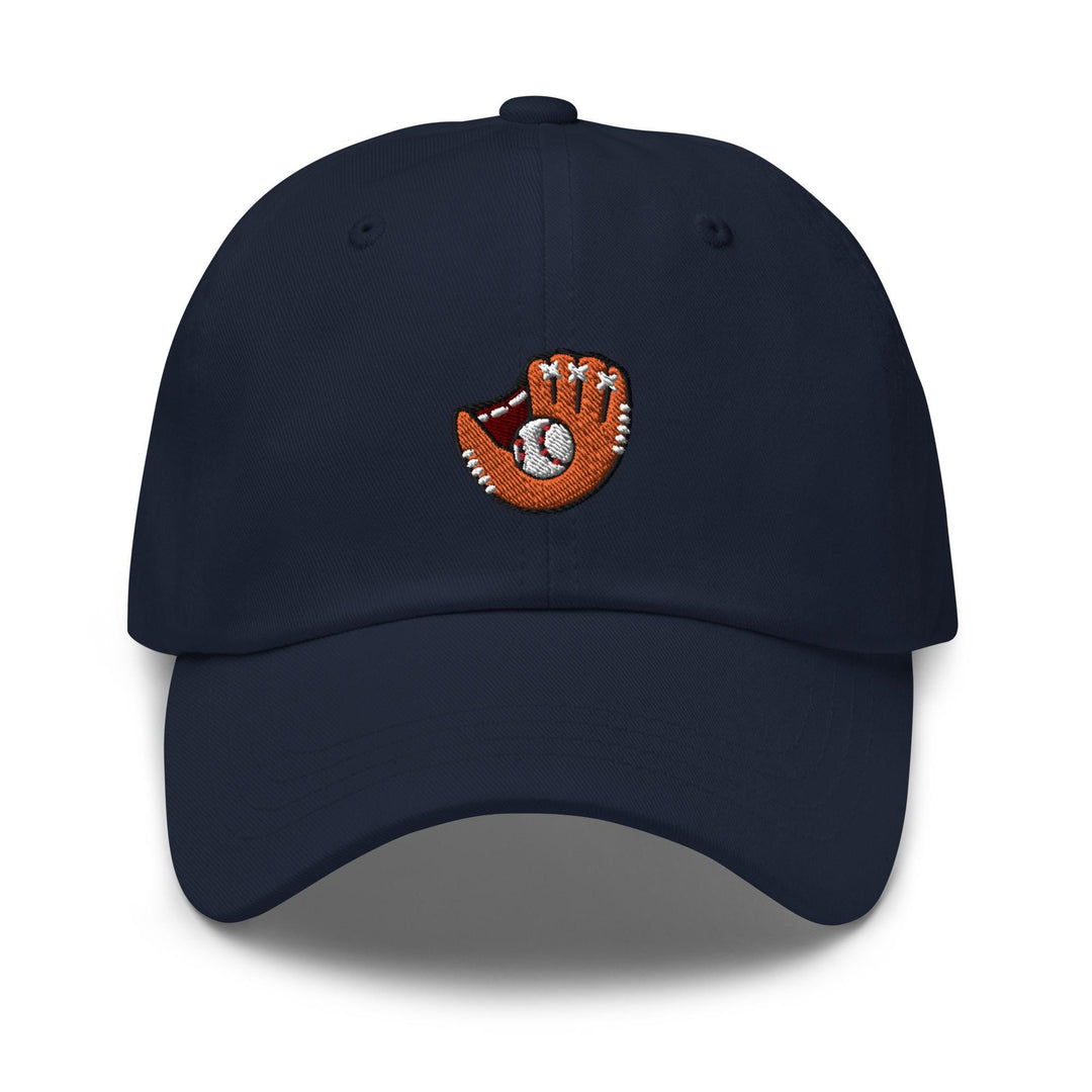 a baseball cap with a hand holding a ball