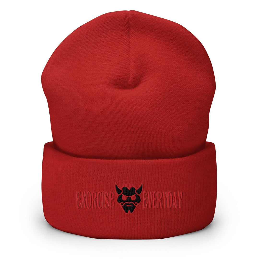 a red beanie with a black logo on it