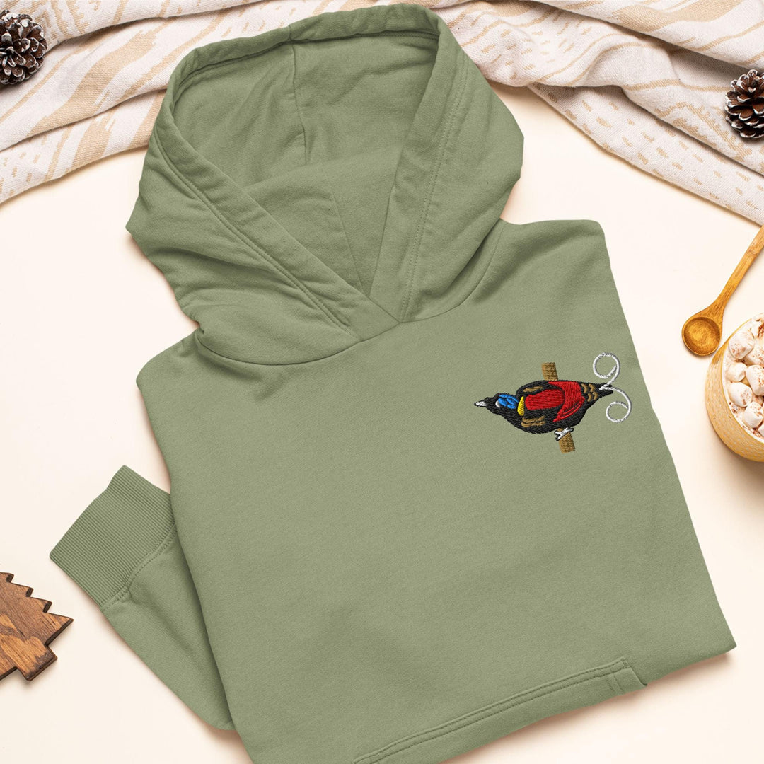 a green hoodie with a bird embroidered on it