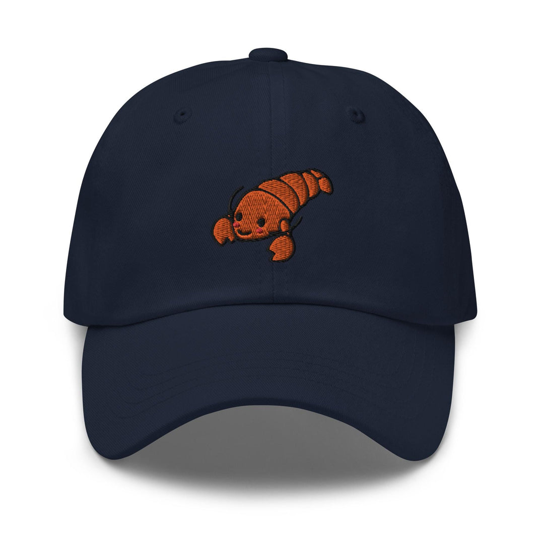 a baseball cap with an orange fish embroidered on it