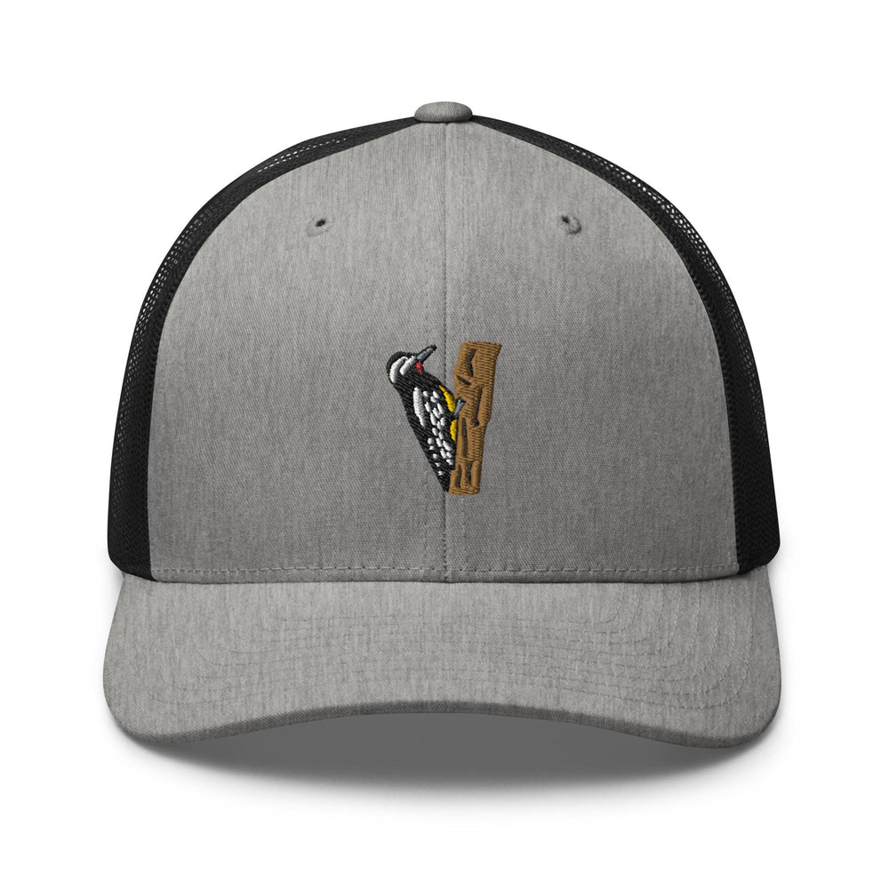 a gray and black hat with a bird on it