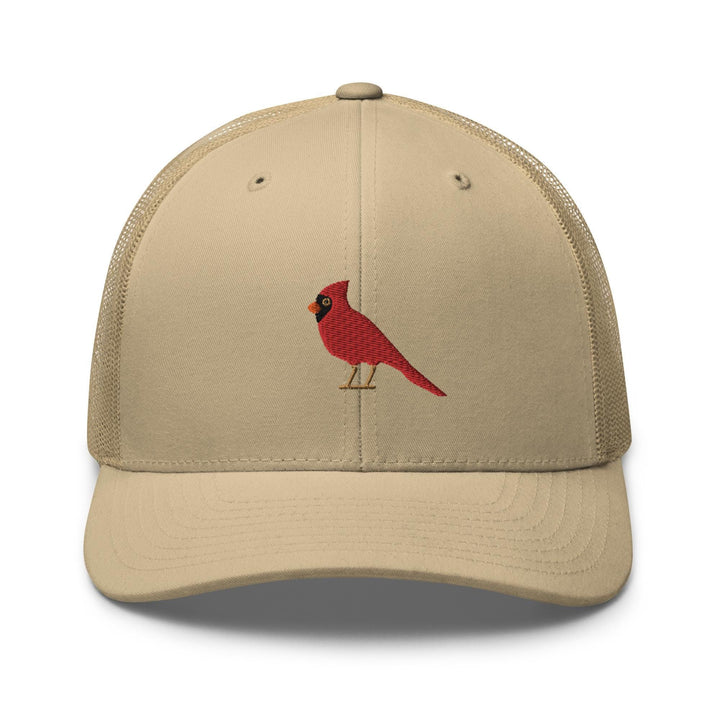 a red bird embroidered on a tan trucker hat