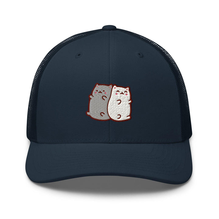 a blue trucker hat with two cats on it