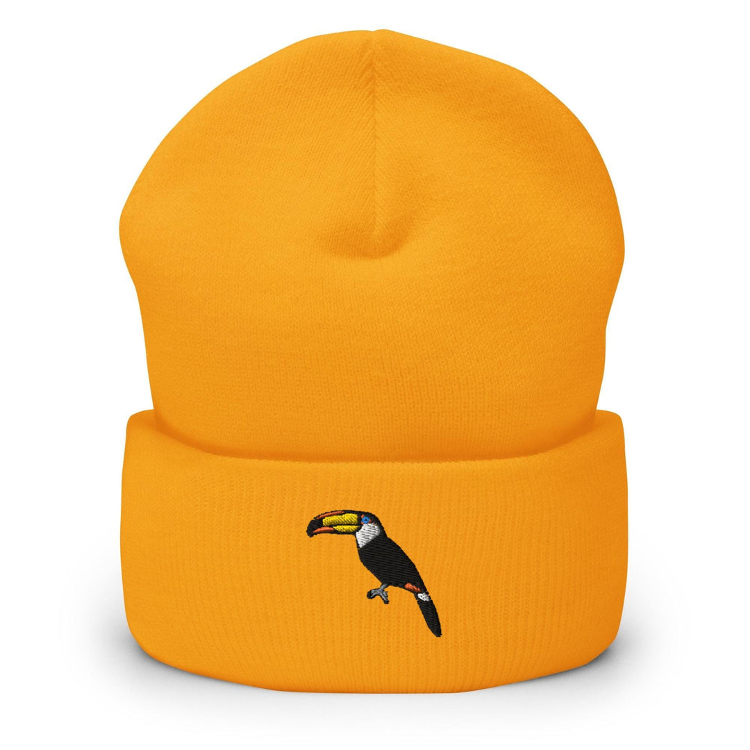 a yellow beanie with a toucan on it