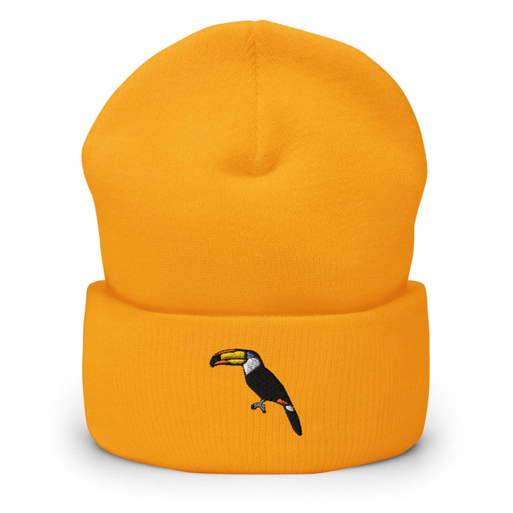 a yellow beanie with a toucan on it