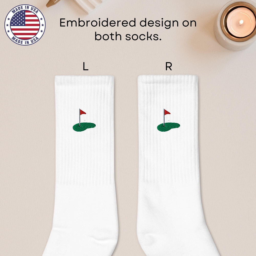 a pair of white socks with a red flag on it