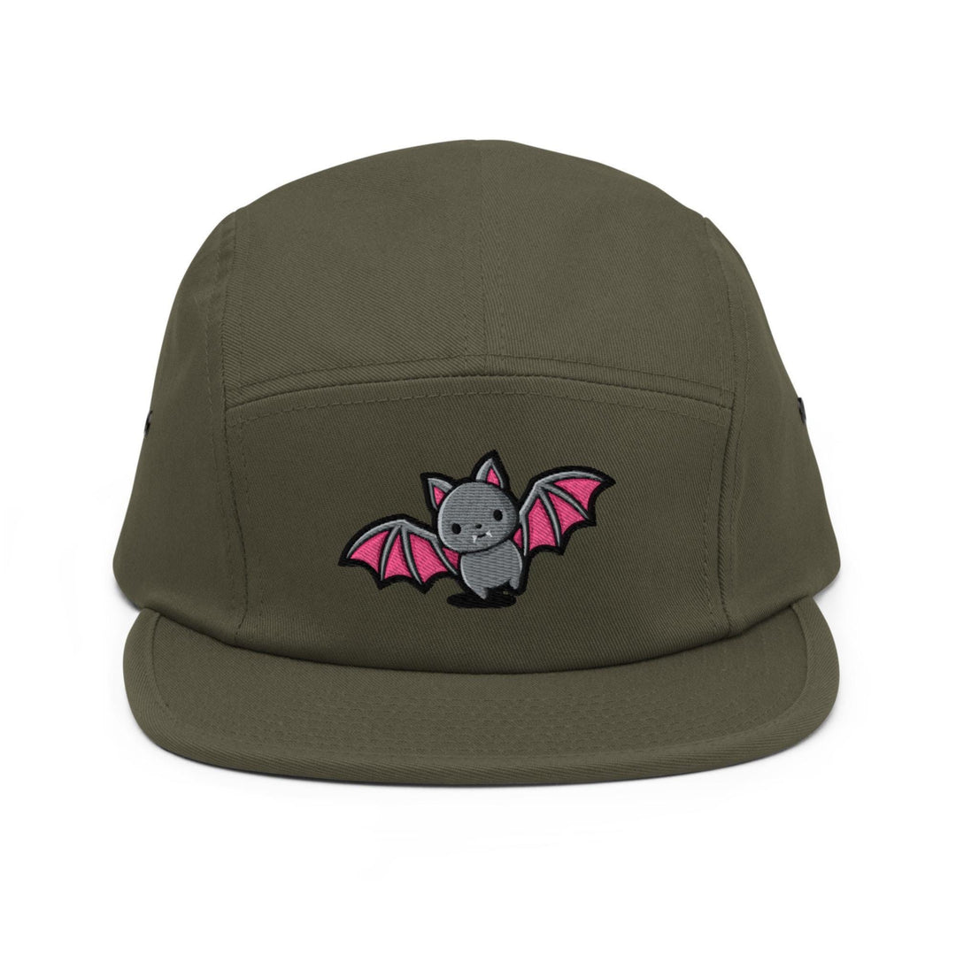 a green hat with a bat embroidered on it