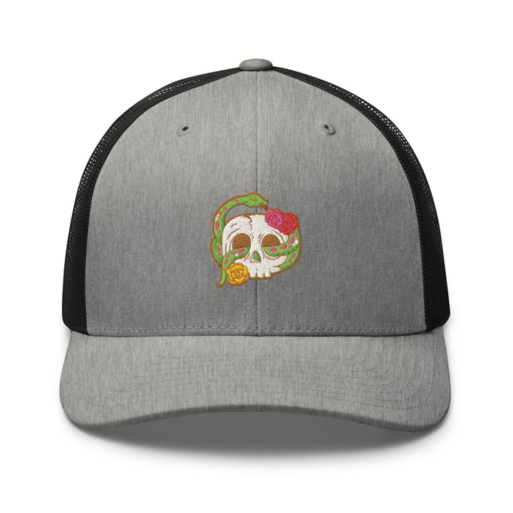 a gray and black trucker hat with a skull on it