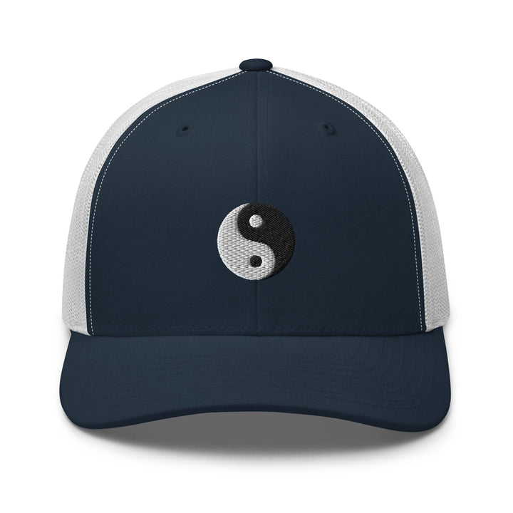 a blue and white hat with a yin symbol on it