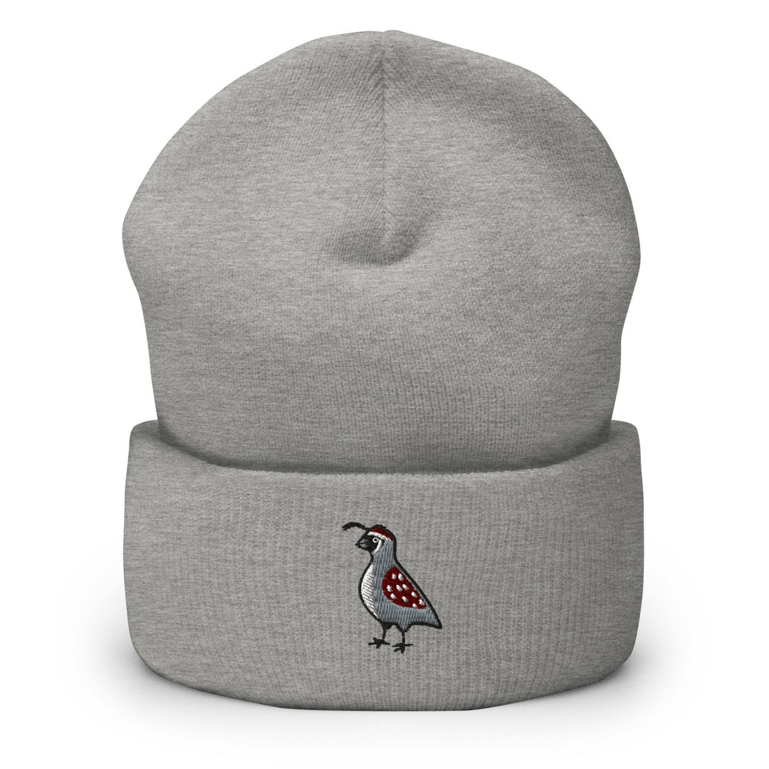 a grey beanie with a bird embroidered on it