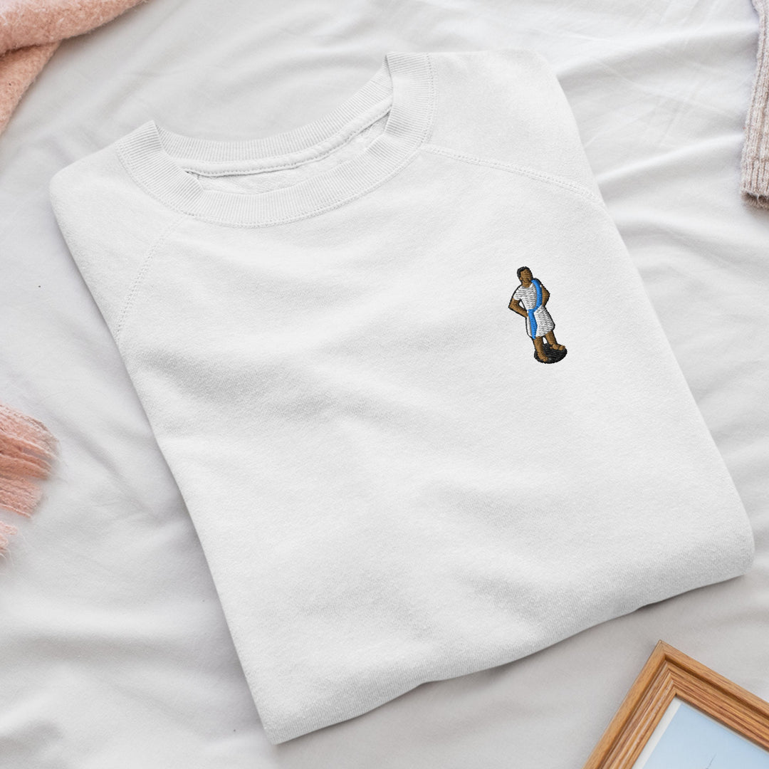 a white t - shirt with a picture of a man on it
