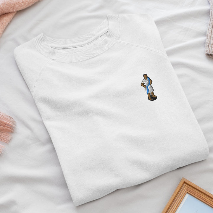 a white t - shirt with a picture of a man on it