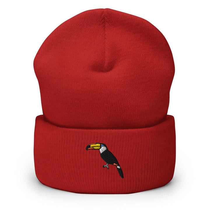 a red beanie with a toucan on it