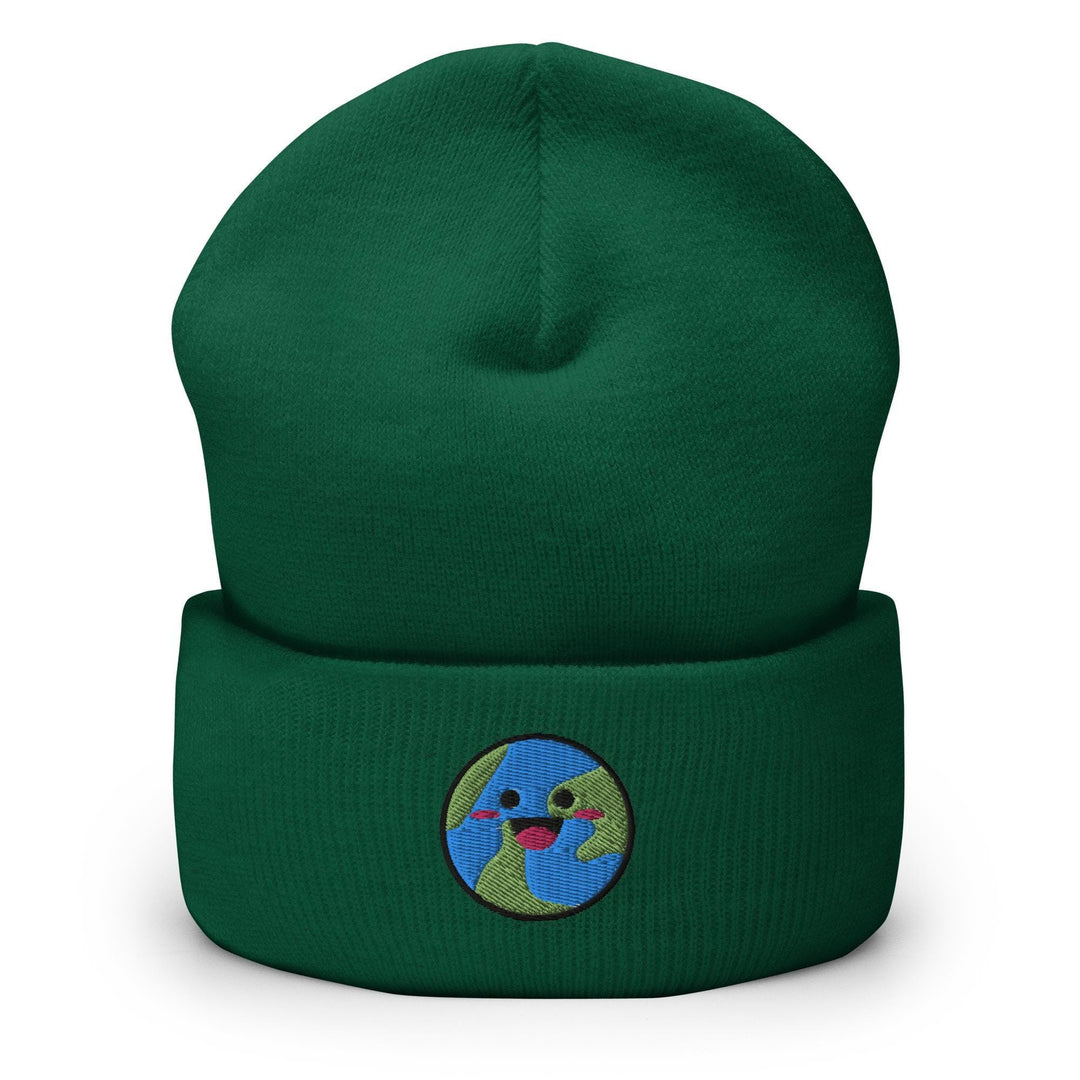 a green beanie with a smiling face on it