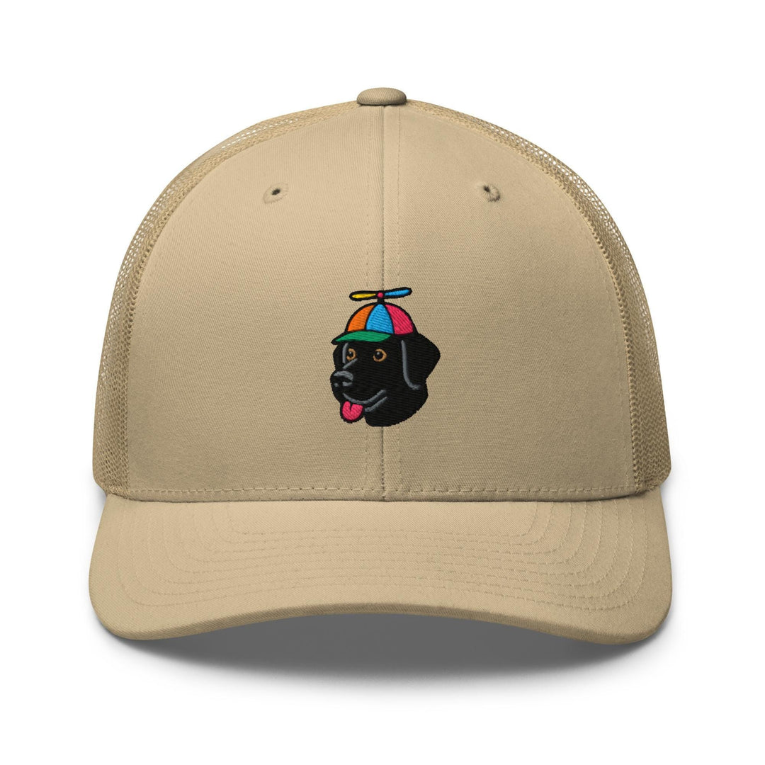 a tan trucker hat with a black dog wearing an umbrella