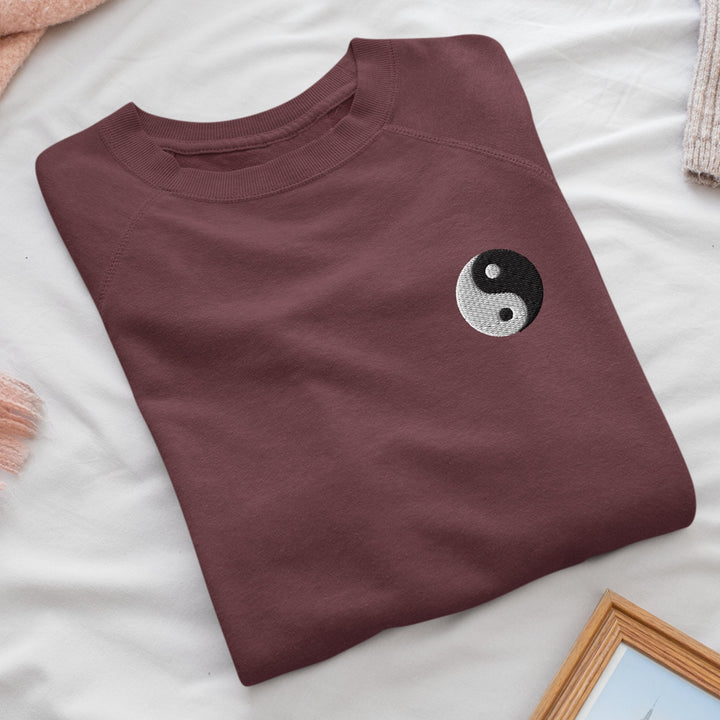 a t - shirt with a yin symbol on it