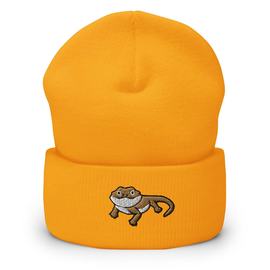 a yellow beanie with a picture of a monkey on it