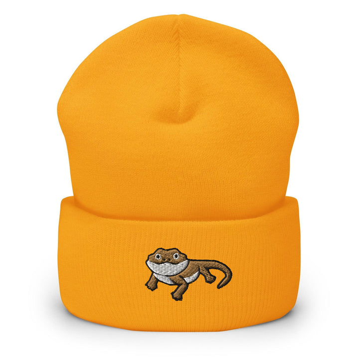 a yellow beanie with a picture of a monkey on it