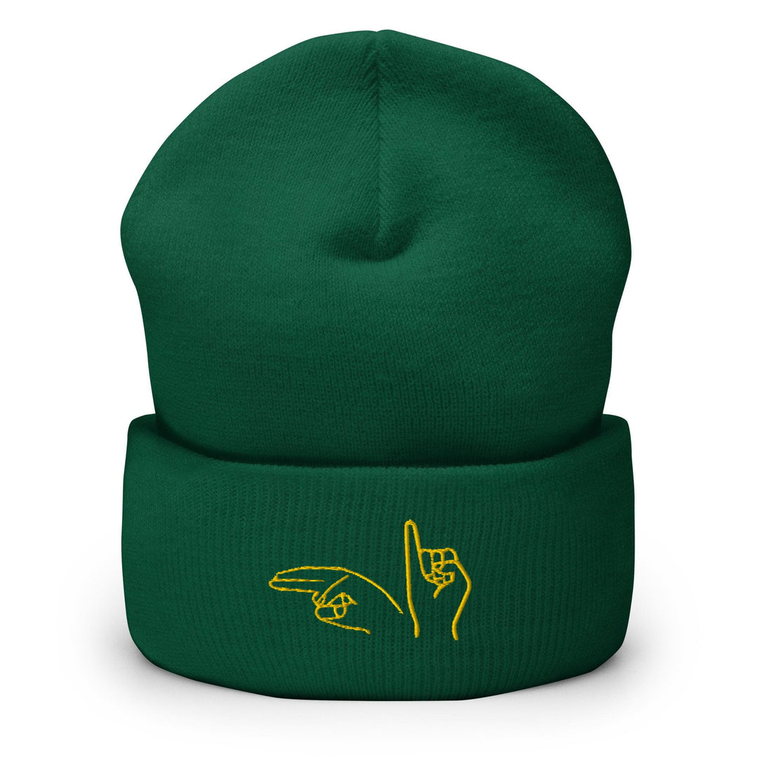 a green beanie with a yellow logo on it