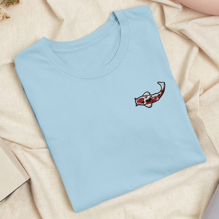 a blue t - shirt with a picture of a fish on it